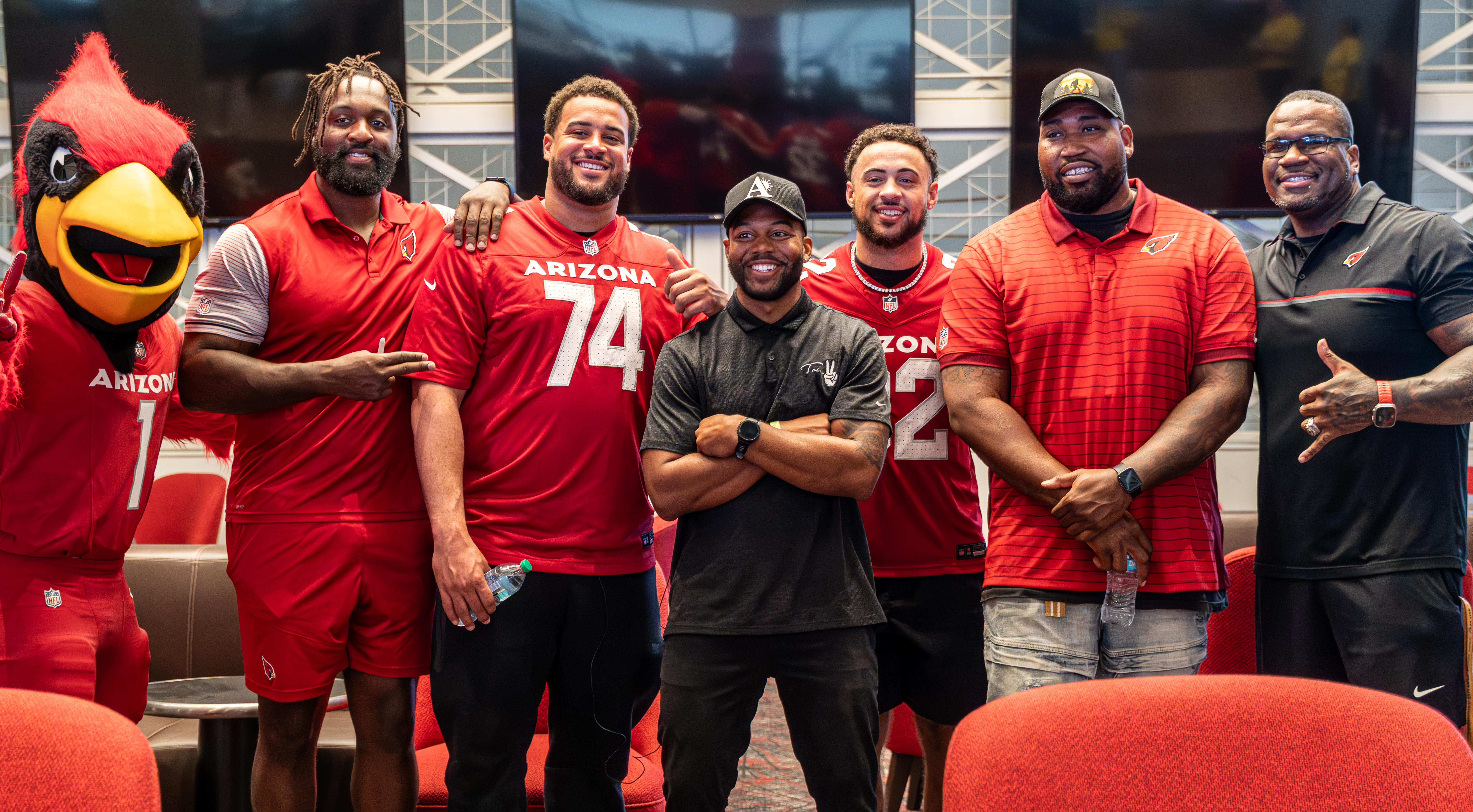DJ Take2 with Arizona Cardinals players