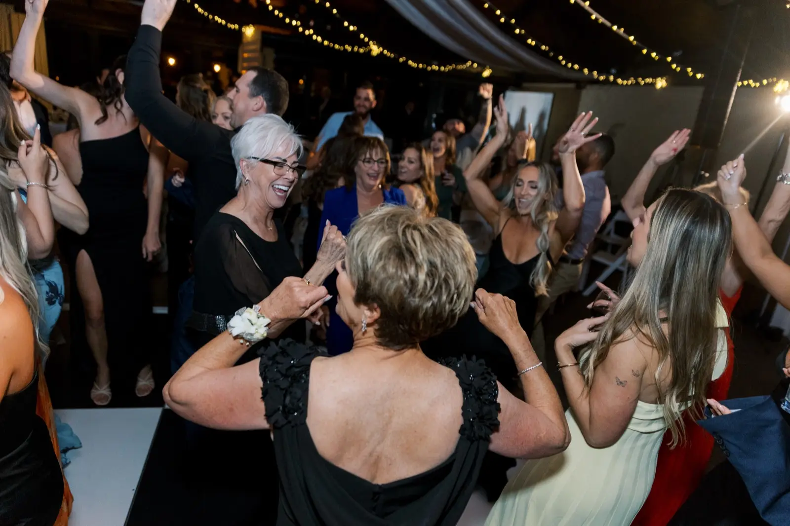Guests dancing at a milestone celebration